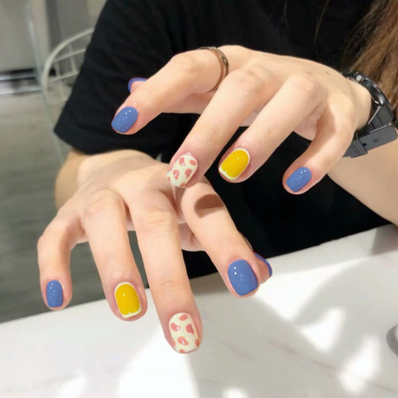 Summer Fun Short-Length Squoval Press On Nail Set in Pastel Blue, Yellow & Patterned Accent Nails