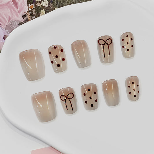 Charming Elegance Short Square Beige Ombre Press-On Nail Set with Bow and Dot Accents