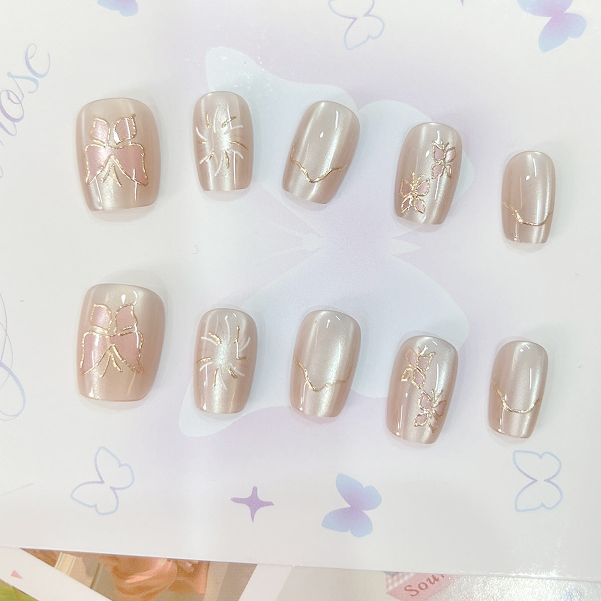 Whimsical Elegance Medium Square Beige Press-On Nail Set with Intricate Gold Foil Designs