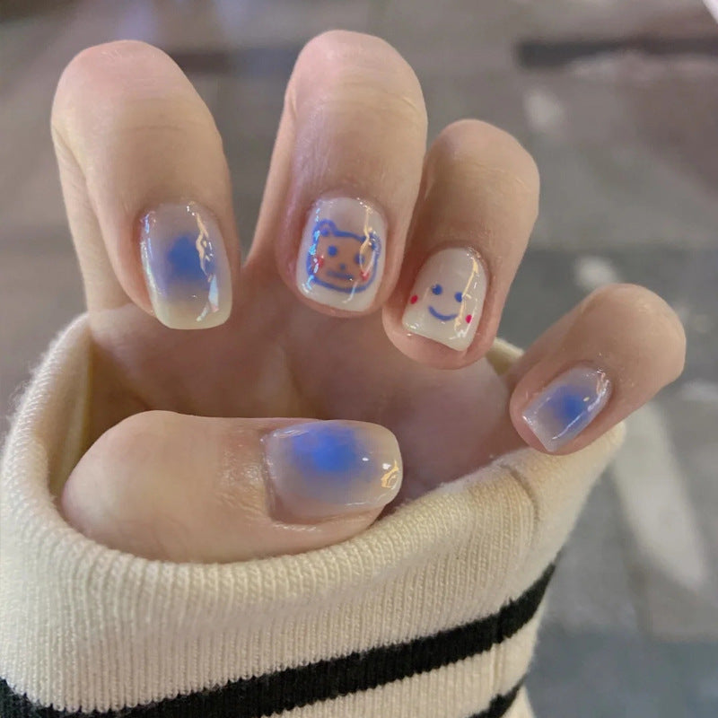 Whimsical Winter Wonderland Short Round Press On Nail Set in Iridescent White with Playful Snowman Accents