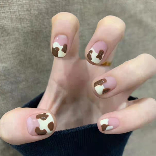Enchanted Cow Print Short Length Oval Press On Nail Set in Pink and Brown with Glossy Finish