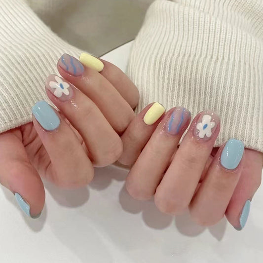 Springtime Blossom Short Oval Pastel Blue and Yellow Press On Nails with Floral Accents