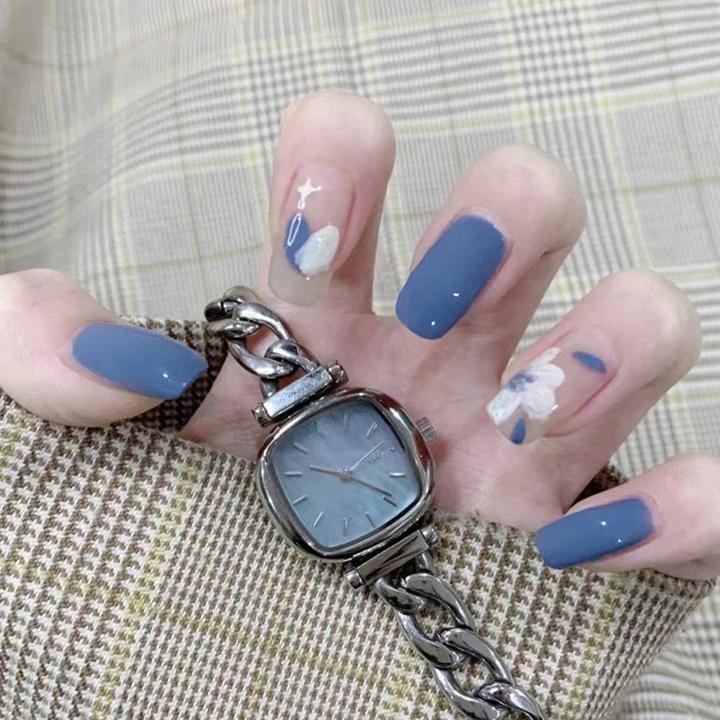 Starry Night Elegance Medium-Length Oval Navy Blue Press On Nail Set with Floral Accents and Gloss Finish