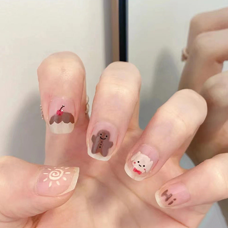 Winter Wonderland Short-Length Oval Beige Press On Nail Set with Festive Character Accents