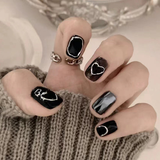 Elegant Affair Short Oval Black Press On Nail Set with Glossy Finish and Silver Accents