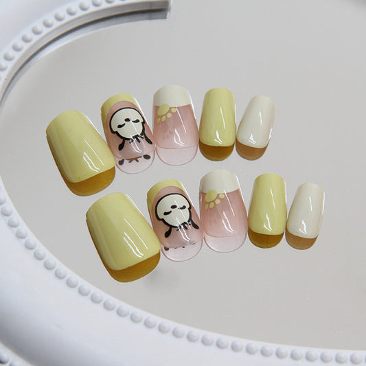 Springtime Celebration Medium Length Coffin Press On Nail Set in Pastel Yellow with Adorable Penguin Accents