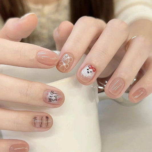 Whimsical Charm Short-Length Oval Beige Press On Nail Set with Cute Animal Accents and Calligraphy Design