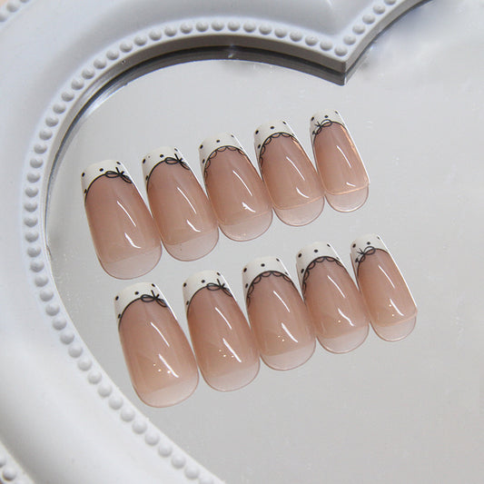 Elegant Charm Medium Coffin Press On Nail Set in Beige and White with Delicate Bow Design