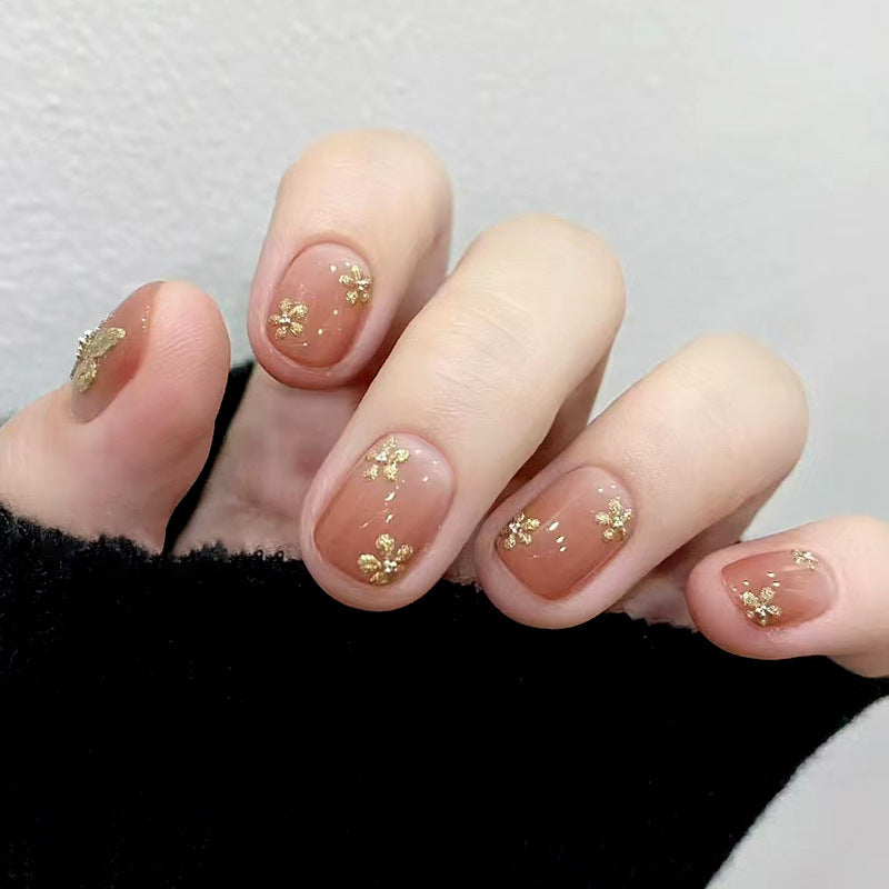 Elegant Blossom Short Squoval Shaped Beige Nails with Gold Floral Accents