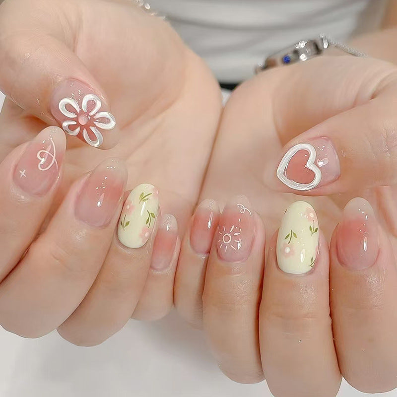 Charming Floral Dream Short Oval Pastel Yellow and Pink Design with Heart and Flower Accents Press-On Nail Set
