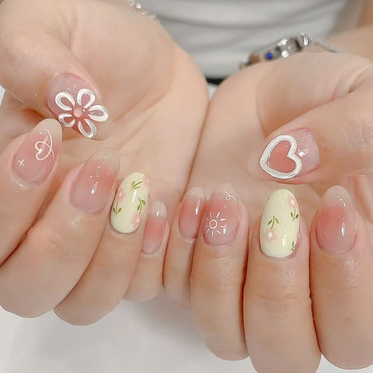 Charming Floral Dream Short Oval Pastel Yellow and Pink Design with Heart and Flower Accents Press-On Nail Set