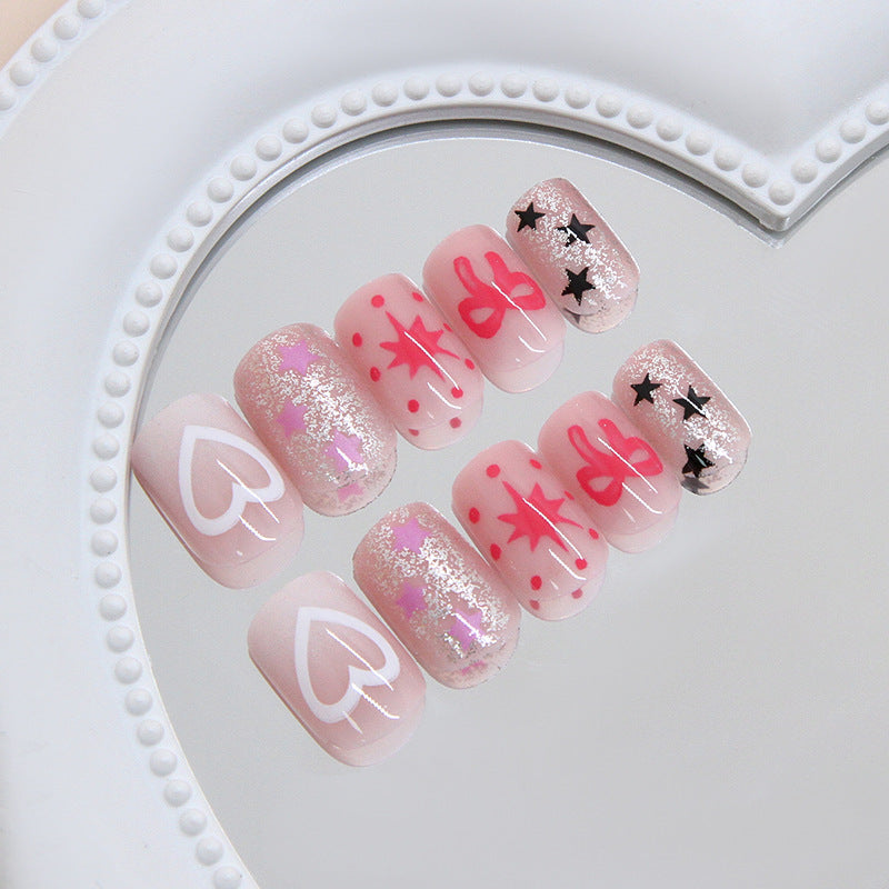 Whimsical Heartbeat Short Square Shaped Soft Pink Press On Nail Set with Glittery Star and Bow Designs