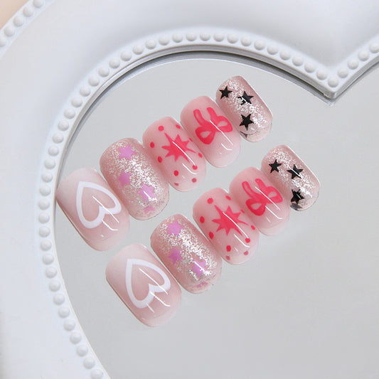 Whimsical Heartbeat Short Square Shaped Soft Pink Press On Nail Set with Glittery Star and Bow Designs