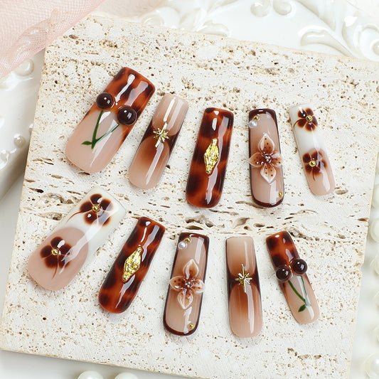 Elegant Botanical Vibe Long Square Brown Gradient Nail Set with Floral Accents and Gold Embellishments
