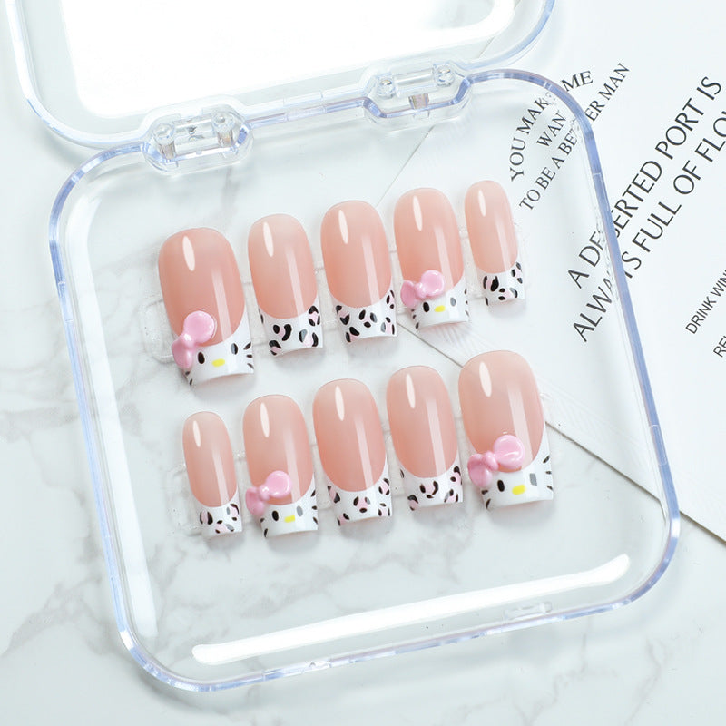 Charming Hello Kitty Inspired Medium Length Square Shaped Soft Pink Nail Set With Unique Bow And Pattern Design