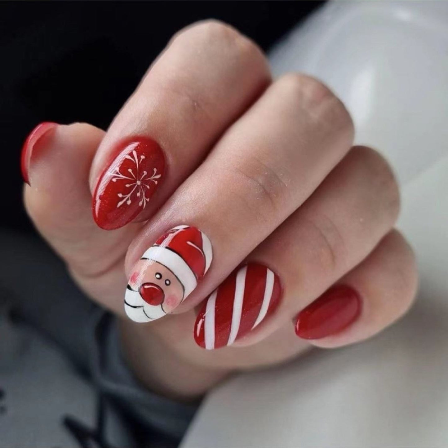 Festive Holiday Themed Medium-Length Oval Red Press On Nails with Santa & Snowflake Art
