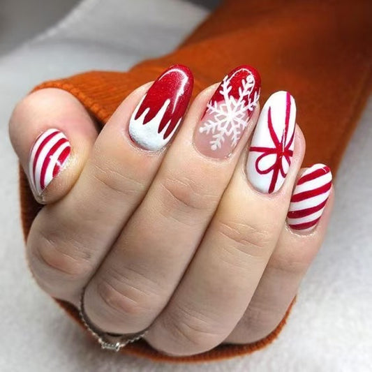 Festive Red and White Medium Oval Shaped Press On Nail Set with Unique Holiday Designs