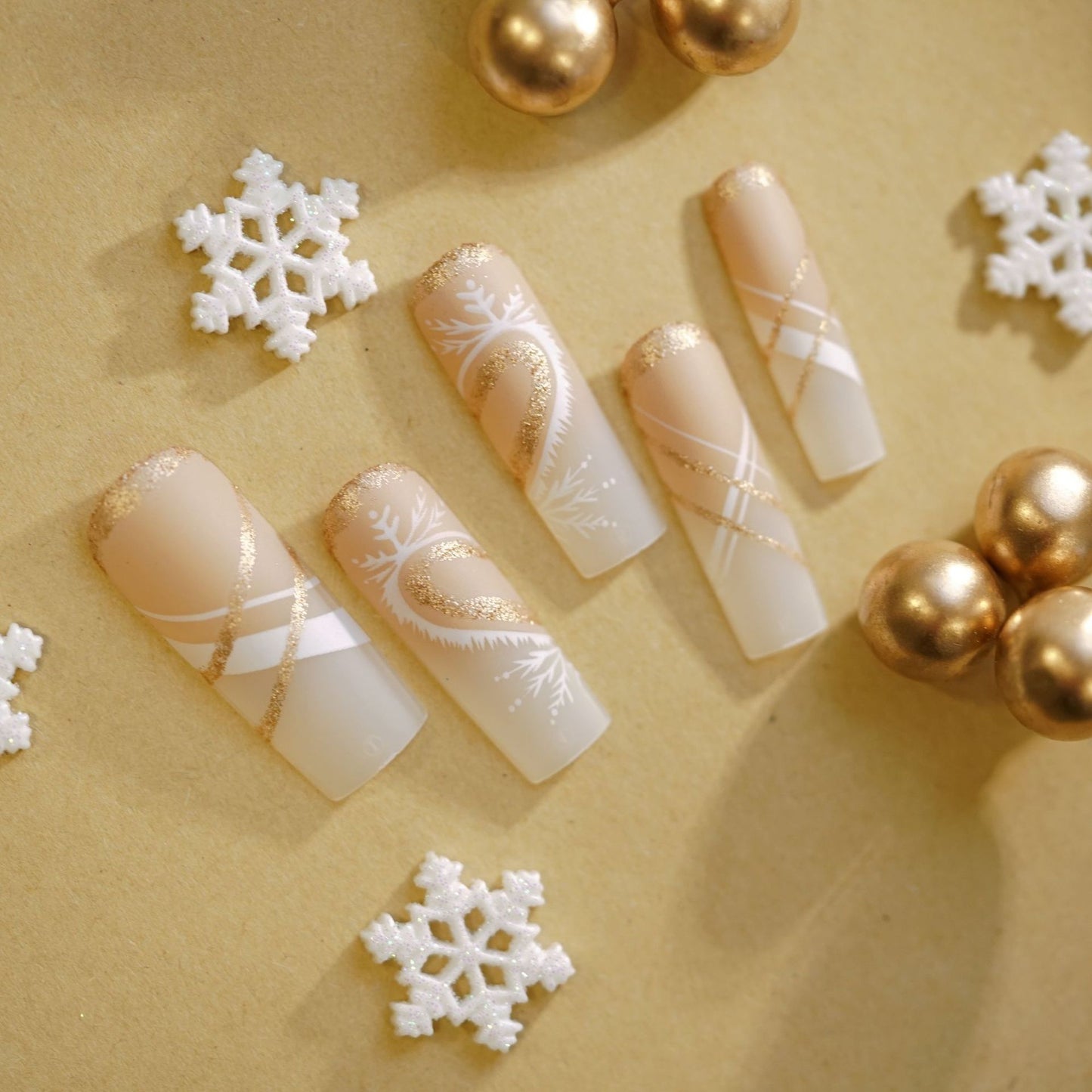 Winter Wonderland Long Square Beige Press On Nail Set with Glittery Gold Accents and Elegant Designs