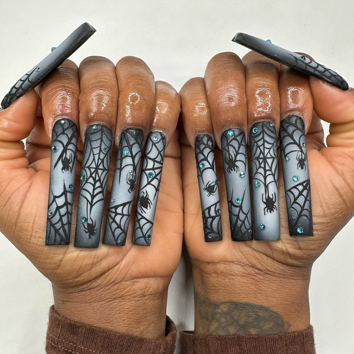 Spooky Elegance Long Square Black Gradient Press on Nail Set with Intricate Spider Web Design and Sparkling Accents