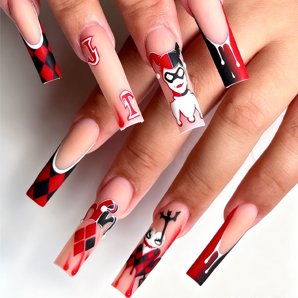 Harlequin Fantasy Long Square Red and Black Press On Nail Set with Unique Comic Character Designs