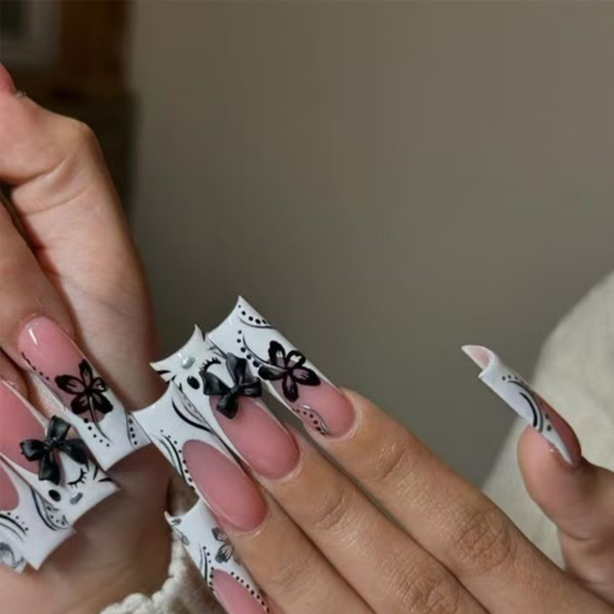 Whimsical Elegance Long Square Shaped White Floral Press On Nails with Black Bow Accents