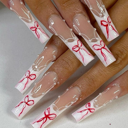 Festive Elegance Long Square Clear White Nails with Charming Red Ribbons and Pearl Accents