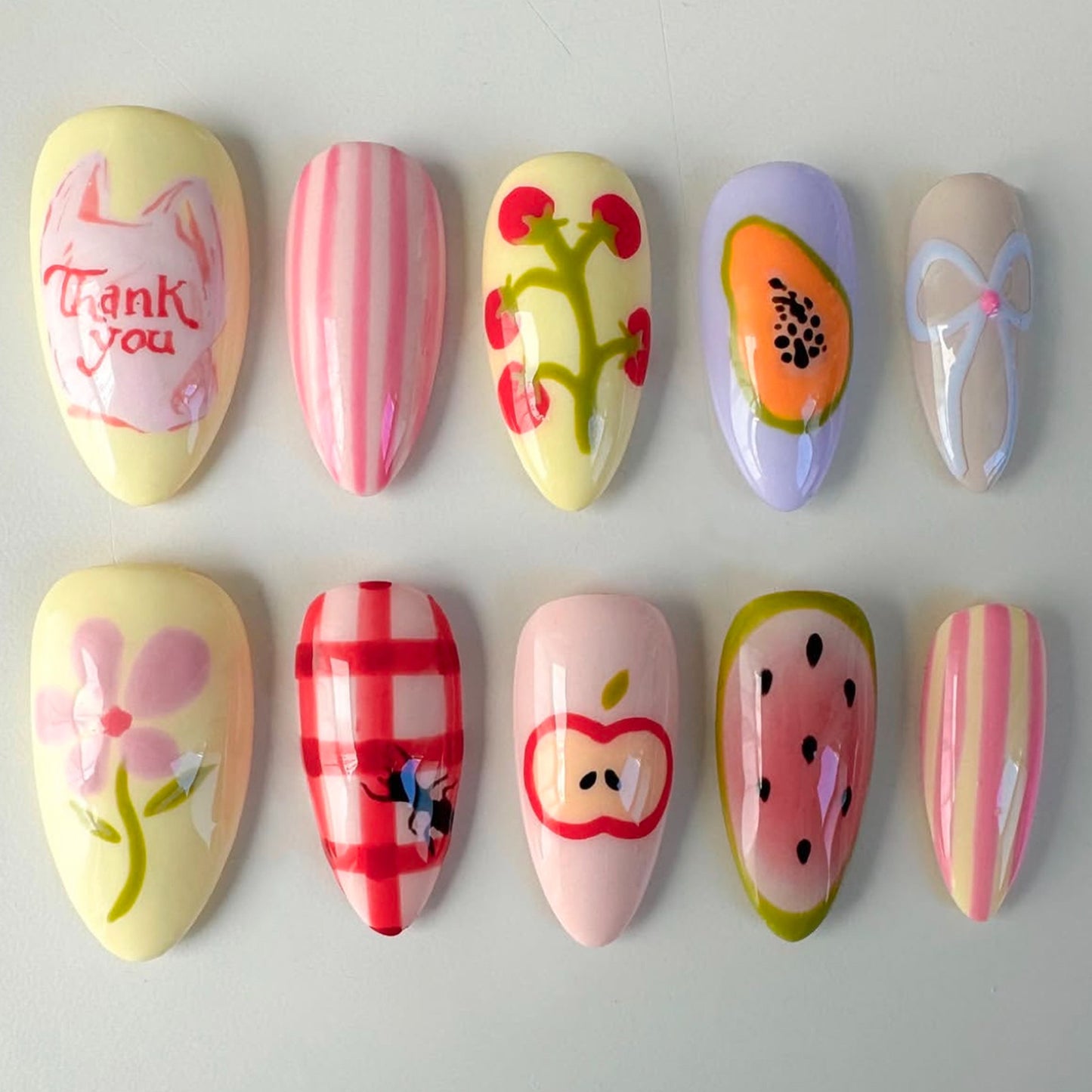 Whimsical Garden Inspired Medium Almond Shaped Soft Yellow and Pink Floral Print Press on Nail Set
