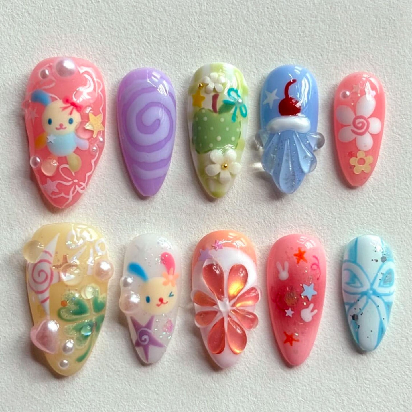 Whimsical Wonderland Colorful Long Almond Press on Nail Set with Cute Cartoon Designs and Charming 3D Elements