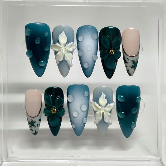 Oceanic Serenity Elegant Long Almond Shaped Teal and Light Blue Press-On Nail Set with Artistic Floral Designs and Textured Accents