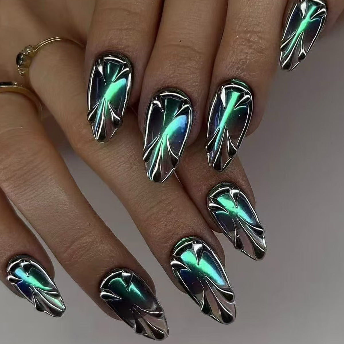 Mystical Radiance Long Almond Shaped Iridescent Green Metallic Press On Nail Set with Unique Curved Design