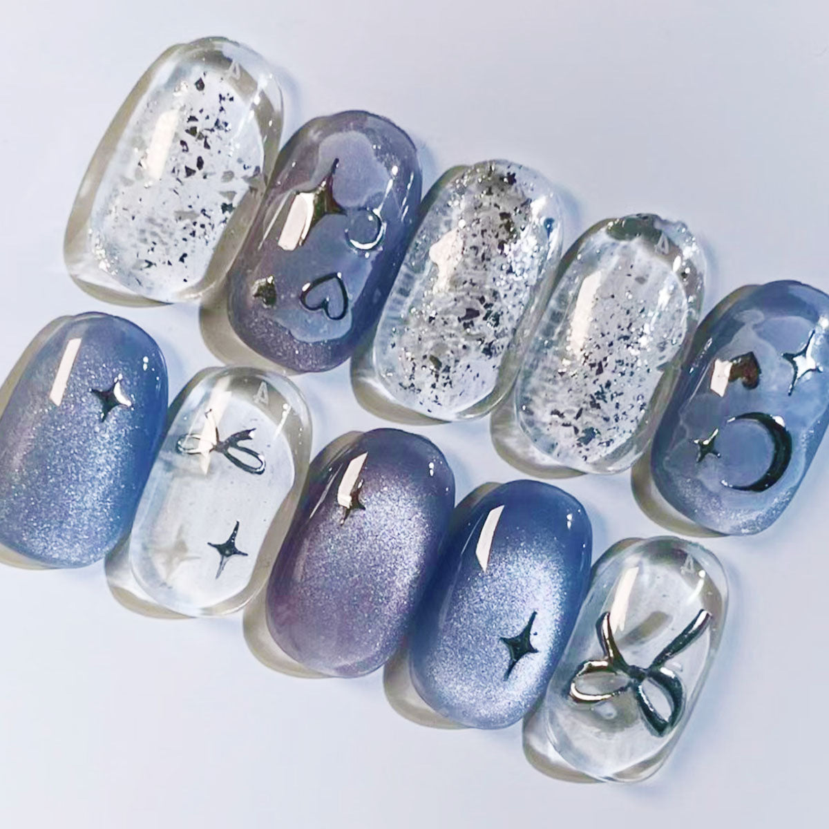 Celestial Dreamscape Short Squoval Press on Nail Set in Ethereal Purple with Shimmering Star Accents