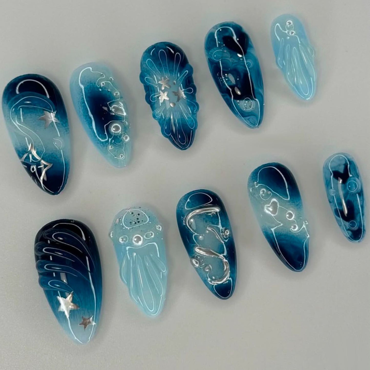 Celestial Dreamscape Long Almond Ombre Blue Nail Set with Stunning Star and Jellyfish Accents