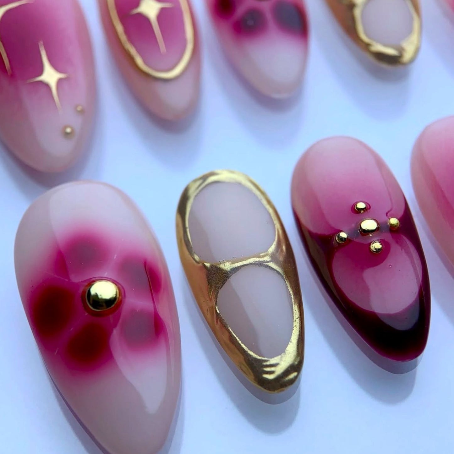 Celestial Blossom Elegant Short Oval Pink Ombre Nails with Gold Accents
