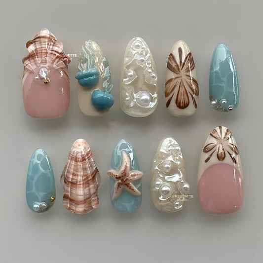 Beach Day Delight Long Almond Aqua Pink and Beige Nails with Sea Inspired Embellishments