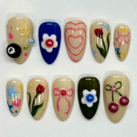 Cheerful Garden Themed Long Almond Shaped Colorful Press On Nail Set Featuring Charming Floral and Playful Design Elements