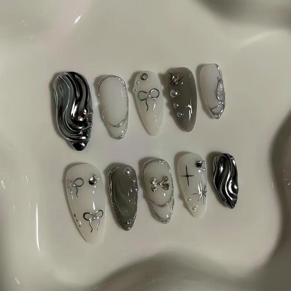 Mystical Elegance Long Almond Shaped Monochrome Nail Set with Unique Metallic Accents
