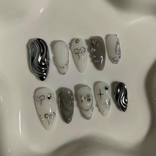 Mystical Elegance Long Almond Shaped Monochrome Nail Set with Unique Metallic Accents