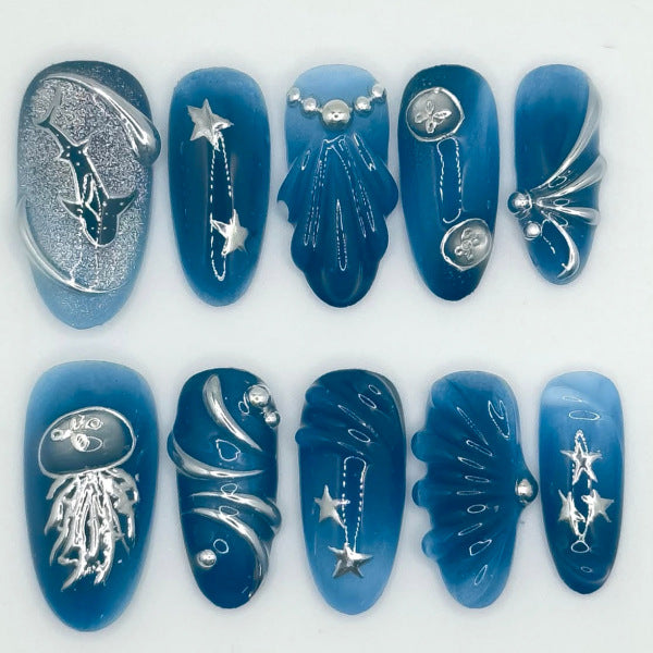 Oceanic Elegance Long Almond Blue Glossy Press On Nail Set Featuring Unique Metallic Designs