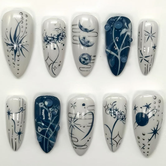Celestial Elegance Long Almond Blue and White Press On Nail Set with Intricate Cosmic Designs