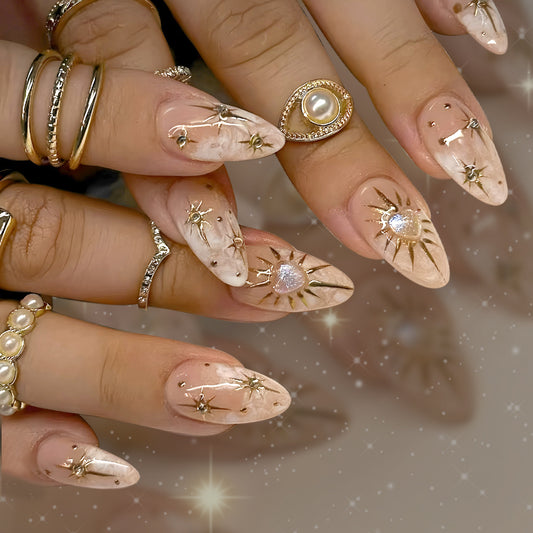 Celestial Elegance Long Almond Beige Nails with Gold Star Accents