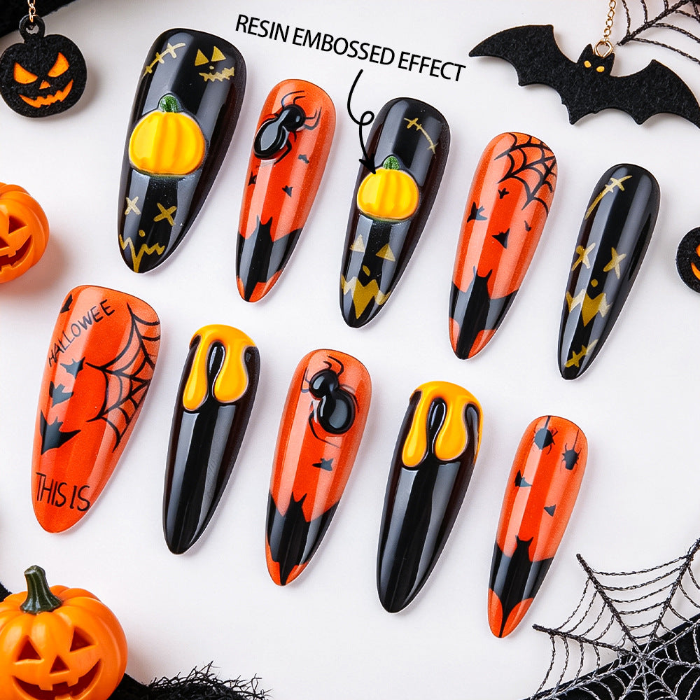 Halloween Themed Long Almond Orange and Black Nails with Unique Resin Embossed Effect