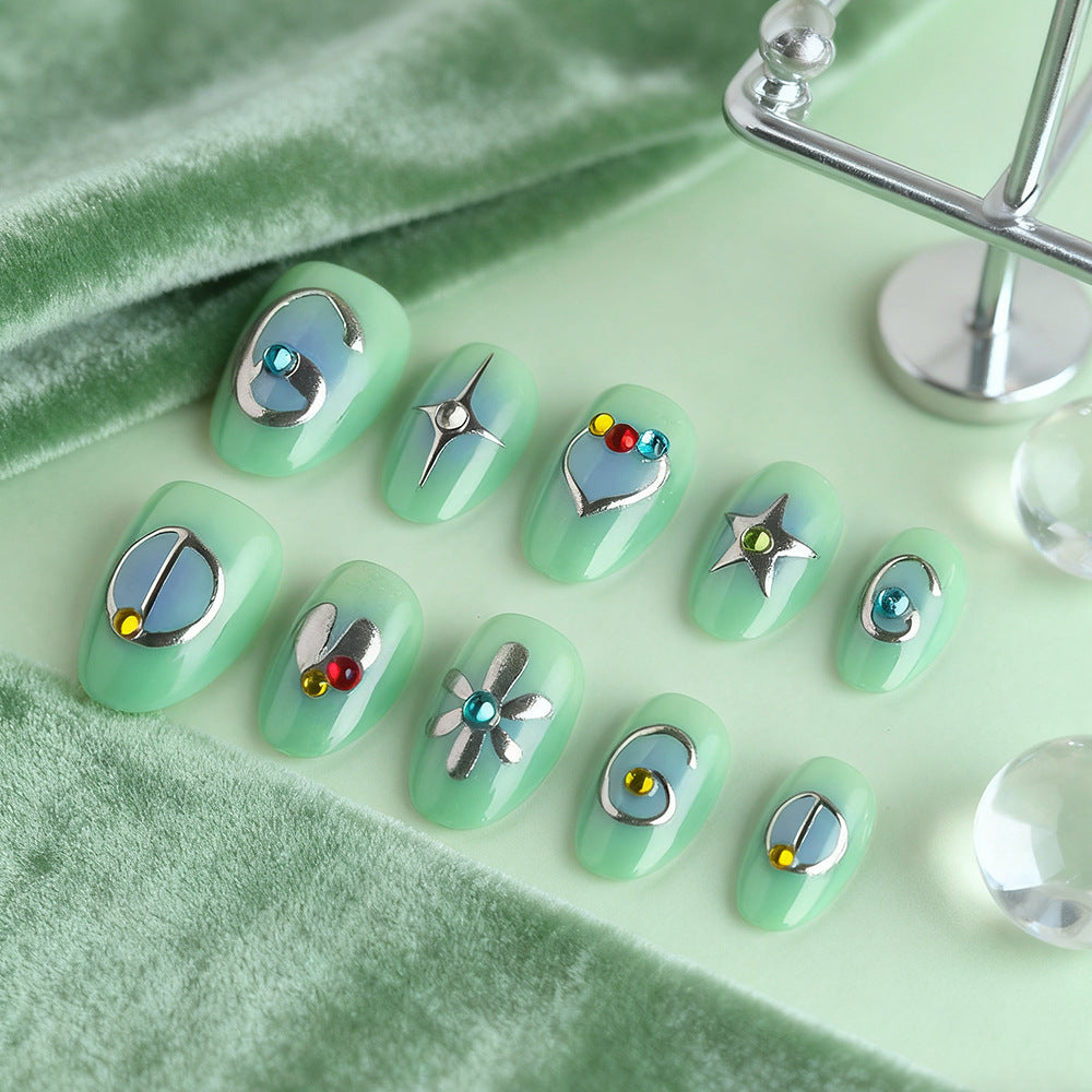 Celestial Dreams Medium Oval Mint Green Press on Nail Set with Unique Metallic Accents