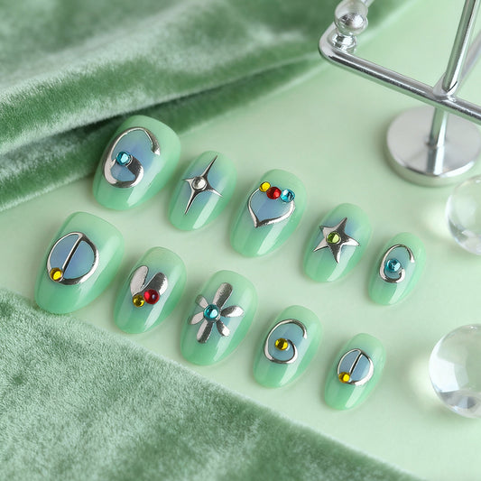 Celestial Dreams Medium Oval Mint Green Press on Nail Set with Unique Metallic Accents