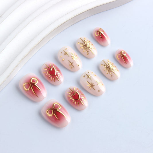 Charming Celebration Medium Oval Pink and Gold Press On Nail Set with Elegant Bow and Star Designs