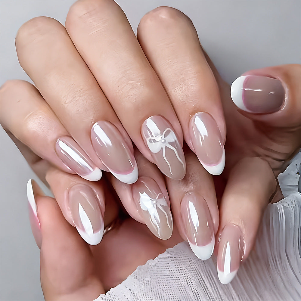 Charming Elegance Long Almond Beige French Tip Press-On Nail Set with Delicate Bow Design