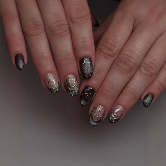 Celestial Elegance Medium Almond Black and Gold Press-On Nail Set with Intricate Moon and Star Designs