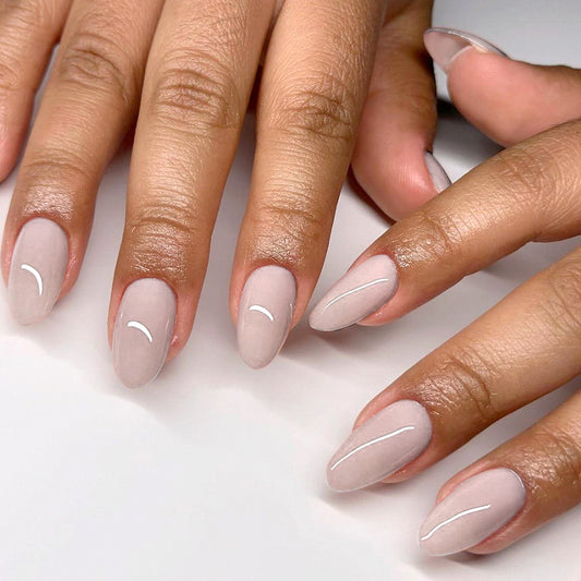Glamorous Elegance Medium Almond Shaped Soft Pink Press On Nail Set with Unique Glossy Stripes