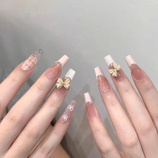 Charming Elegance Long Coffin Pink and Clear Nails with Bow Accent and Glitter Detail