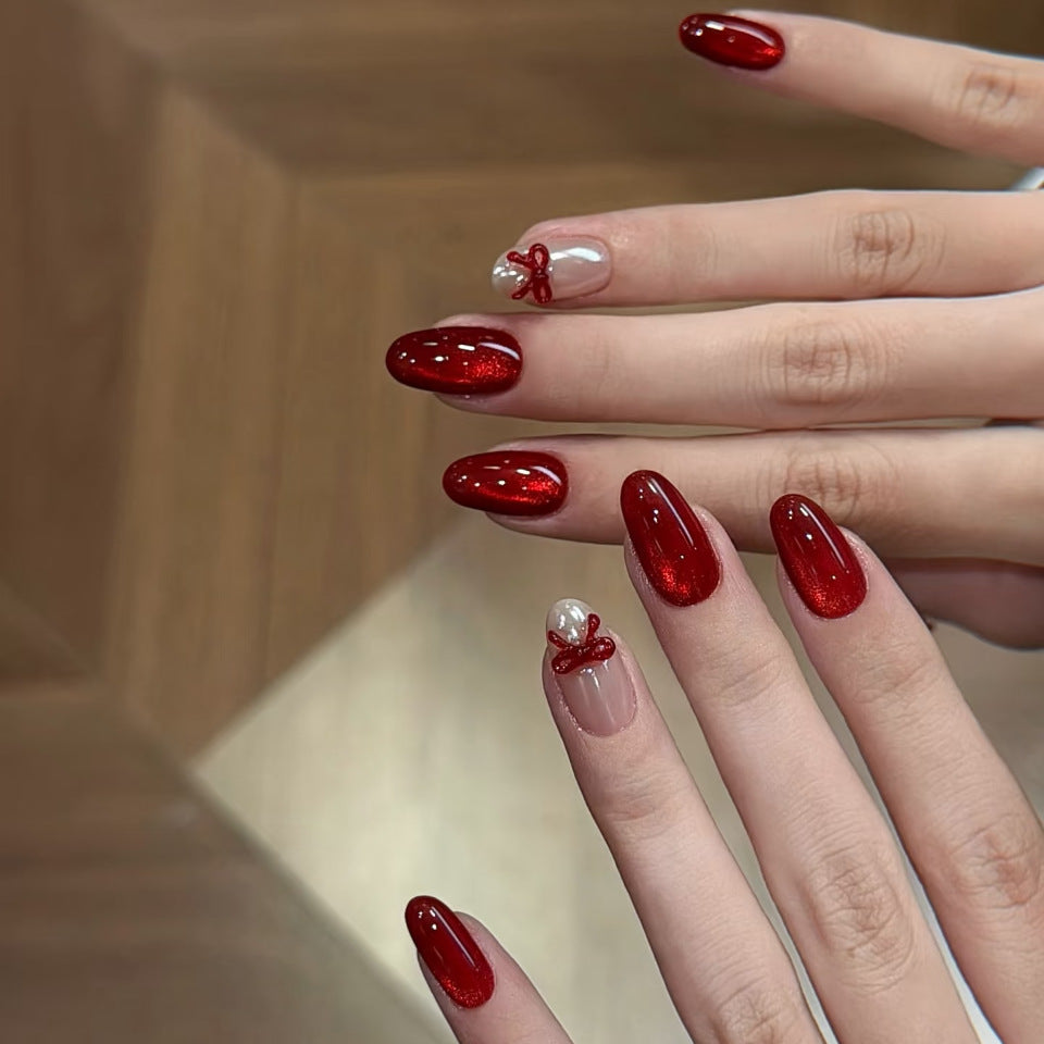 Festive Elegance Long Oval Red Glossy Press On Nail Set with Charming Bow and Pearl Accents