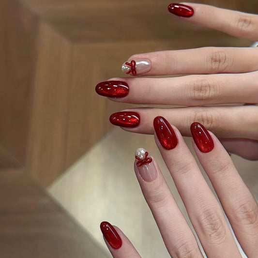 Festive Elegance Long Oval Red Glossy Press On Nail Set with Charming Bow and Pearl Accents